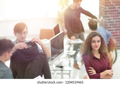 young designer on the background of the creative office. - Shutterstock ID 1204519465