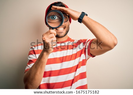 Similar – Man observing something through binoculars