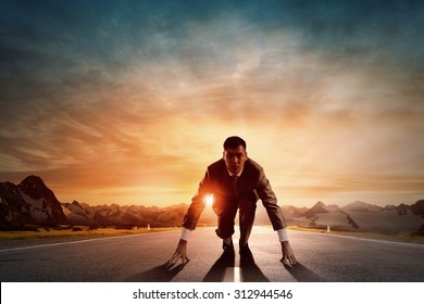 Young determined businessman standing in start position - Powered by Shutterstock