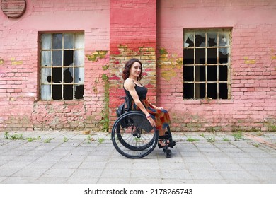 Young Determined Woman With Paraplegia Smiling.
