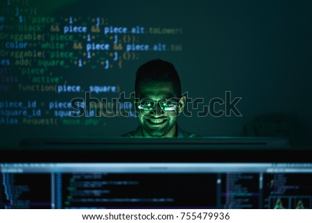 Young developer happy with his programming code
