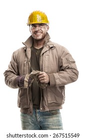 Young Dirty Worker Man With Hard Hat Helmet 
Holding A Work Gloves And Smiling Isolated On White Background