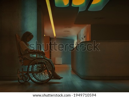 Young disabled woman sitting in an antique wheelchair, alone in the dark corridor of a health center