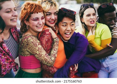 Young diverse friends having fun outdoor laughing together - Focus on asian guy face - Powered by Shutterstock