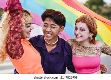 Young diverse people having fun at LGBT pride parade - Shutterstock ID 2149826909
