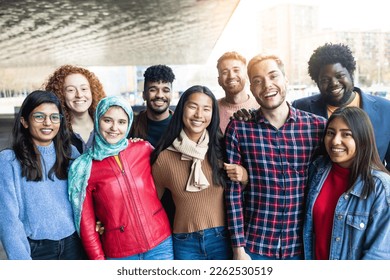 Young diverse people having fun outdoor laughing together - Focus on arabian girl face - Powered by Shutterstock