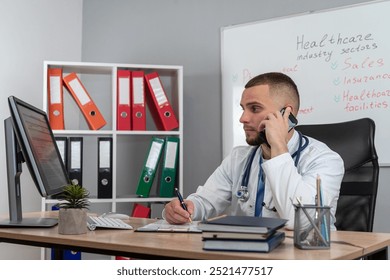 Young doctor or e general practitioner physician  work in patient files at office medical clinic. Prescribing disease treatment