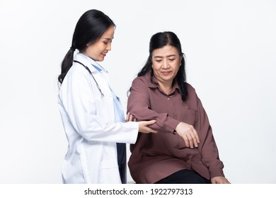 Young Doctor Examines Elderly Asian Woman And Health Check Up On Heart With Stethoscope, Shoulder And Pressure With Smiling Care. Half Body Isolated White Background