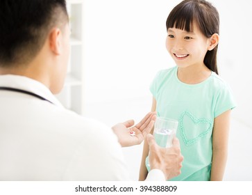 Young Doctor Gives The Child  Medicine