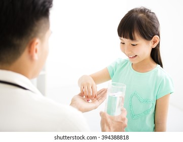 Young Doctor Gives The Child  Medicine