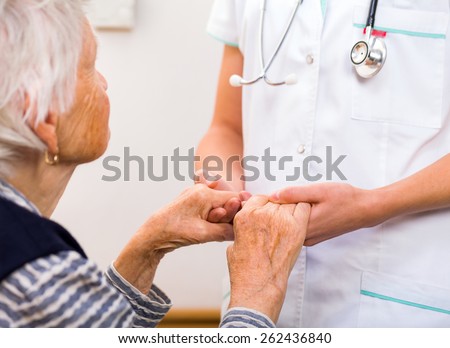 Similar – Female doctor filling out a questionnaire to senior patient