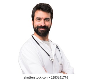 Young doctor with his arms crossed on white background