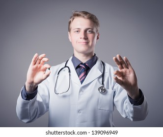 Young Doctor Holding A Pill