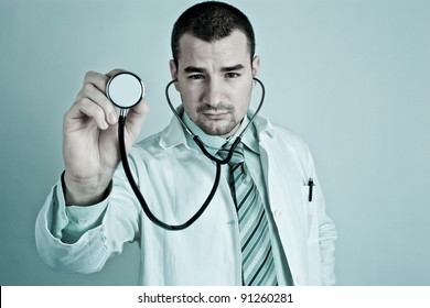 Young doctor holding a stethoscope.