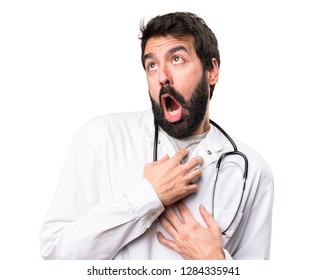 Young doctor in love on white background