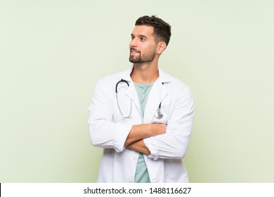 Young Doctor Man Over Isolated Green Wall Laughing