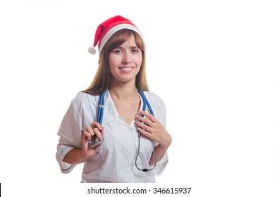 The Young Doctor In A New Year's Cap And A White Dressing Gown Smiles. New Year. Christmas.