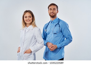 Young doctor and nurse are smiling at the camera             