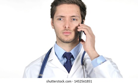 Young Doctor Talking On Smartphone, White Background