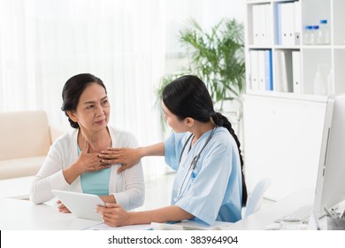 Young Doctor Talking To Senior Patient About Heart Diseases