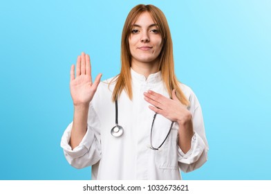 Young Doctor Woman Making An Oath On Colorful Background