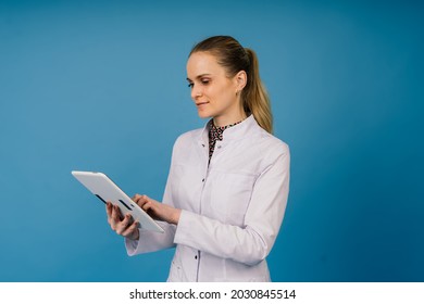 Young Doctor Woman In A White Lab Coat, Studio Shot