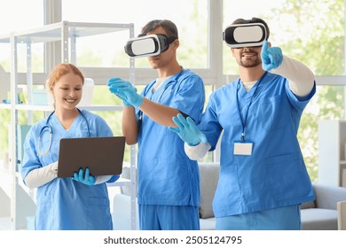 Young doctors with laptop using VR glasses in clinic - Powered by Shutterstock