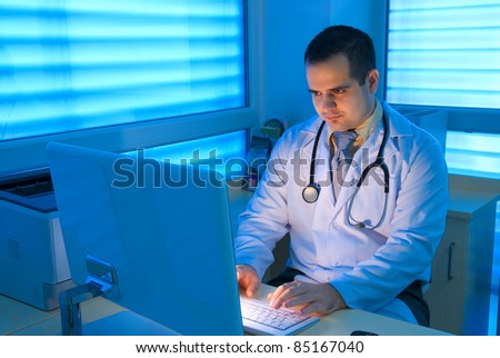 Young doctors working in front of a computer