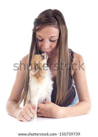 young dog and her chihuahua in front of white background