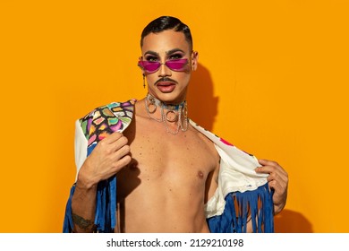 Young Drag Queen In Colorful Dress On Yellow Background