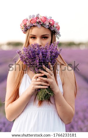 Similar – Woman posing in field of white flowers