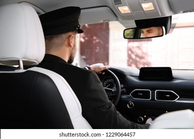 Young Driver In Luxury Car. Chauffeur Service