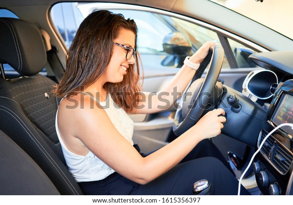 Young driver woman driving
car
