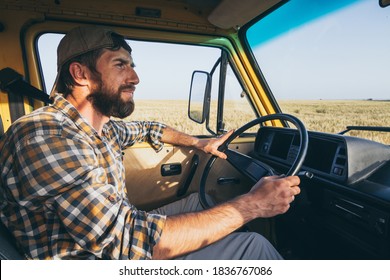 Young Eastern European Man Travelling By Yellow Camper Van Though The Countryside. Self Built Off-grid Motorhome Camping In The Wild Nature.