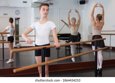 Young efficient dancer exercising in ballroom. High quality photo