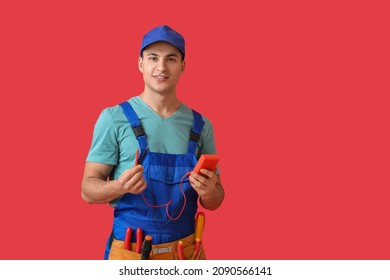 Young Electrician With Multimeter On Color Background