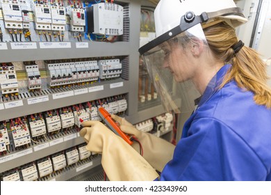 Young Electrician Woman At Work