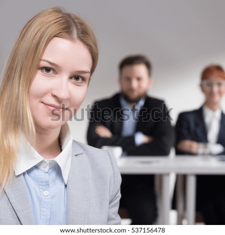 Young elegant applicant after the jobinterview  in corporation
