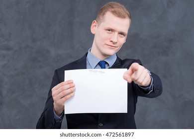 Young Elegant Man In Suit, Holding A Copy Space And Pointing Something In Front Of Him