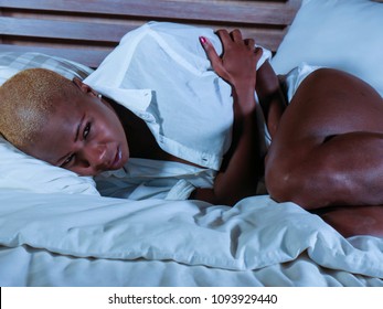 Young Elegant Sad And Depressed Black Afro American Woman Suffering Period Pain Or Stomach Ache And Abdominal Cramp Holding Her Tummy Feeling Sick And Unwell In Menstruation Cycle And Lifestyle