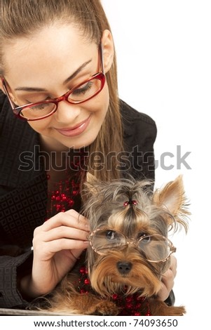 The young elegant woman with Yorkshire Terrier isolated on a white background