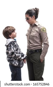 Young Elementary Boy Is Confronted By Female Sheriff Deputy On White Background