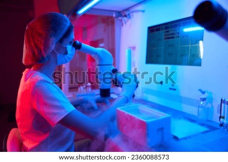 Young embryologist at work in a cryo-laboratory