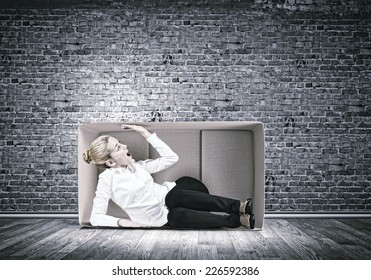 Young Emotional Woman Trapped In Carton Box