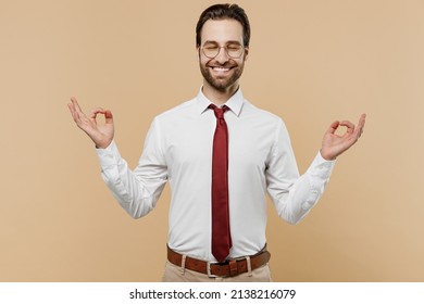 Young Employee Business Man Corporate Lawyer 20s Wear Classic Formal White Shirt Red Tie Work In Office Spread Hands In Yoga Om Gesture Relax Meditate Try Calm Down Isolated On Plain Beige Background