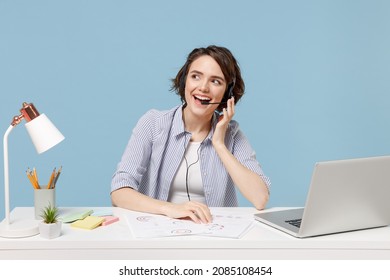 Young Employee Business Operator Woman In Casual Shirt Set Microphone Headset For Helpline Assistance Sit Work At Office Desk With Pc Laptop Talking Speaking Isolated On Pastel Blue Background Studio