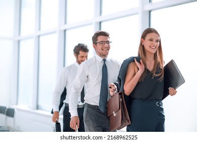 young employees leaving the office at the end of the working day