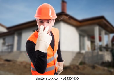 Young engineer doing look into my eyes sign outdoors with copytext space