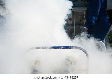 Young Engineer Fill With Liquid Nitrogen With Nitrogen Storage Tank At New Factory