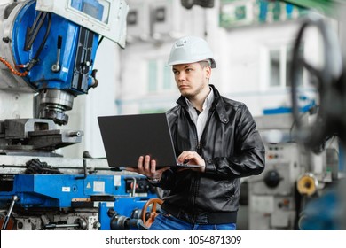 Young Engineer With Laptop In Hands